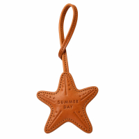 Handcrafted brown leather starfish-shaped bag charm featuring a "Summer Day" embossed text and durable leather loop strap.