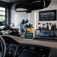Custom paper car air freshener hanging inside a vehicle after car wash and detailing