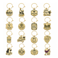 Assorted custom metal wine charms with engraved logos, wine-themed artwork, vineyard branding, and decorative shapes designed for wine events, gifts, and promotional campaigns.