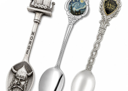 Different custom souvenir spoon styles including antique silver, decorative handle, and branded collectible spoon designs