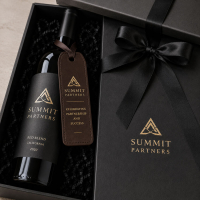 Branded leather wine bottle tags presented in luxury corporate gift packaging