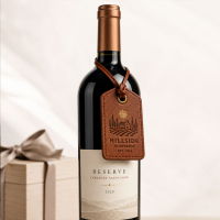 Custom leather wine bottle tag attached to a retail wine bottle
