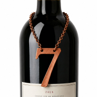 Custom number-shaped leather wine bottle tag for anniversary and limited edition packaging
