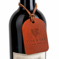 Custom debossed leather wine bottle tag attached with leather cord