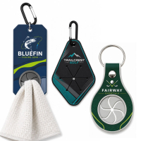 Assorted custom PVC towel holder designs with rectangular, diamond, and round grip styles for sports and promotional applications.