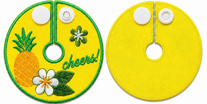Yellow embroidered wine stem tag with white plastic button closure, front and back views