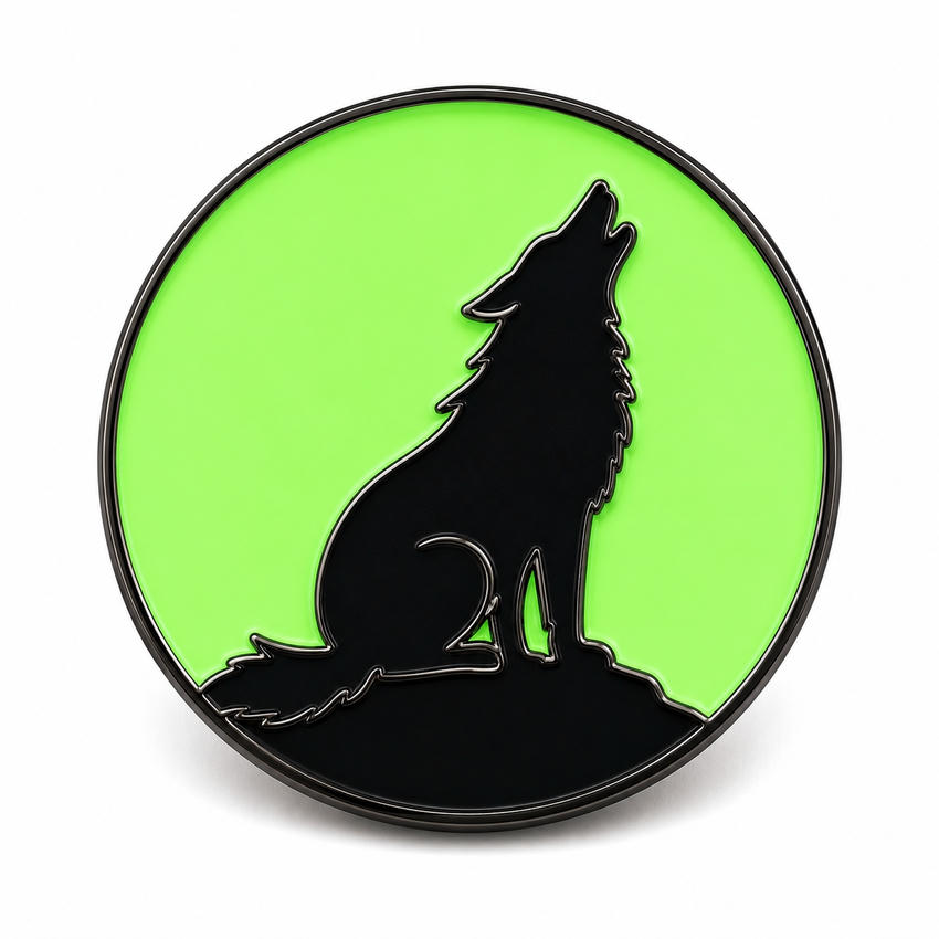 Glow-in-the-Dark Wolf Silhouette Enamel Pin Round black metal pin with a howling wolf silhouette against a large luminous green background.
